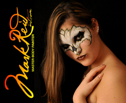 woman with a white and black mask painted around her eyes